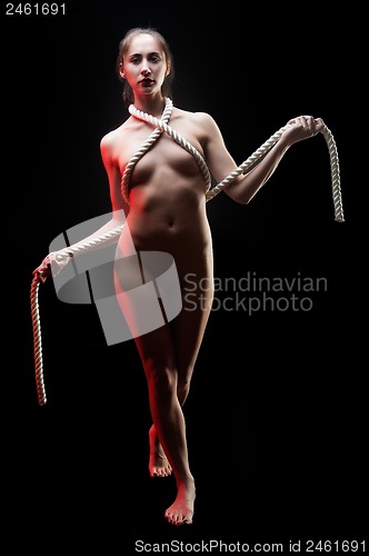 Image of attractive naked woman with rope