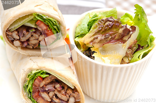 Image of kafta shawarma chicken pita wrap roll sandwich