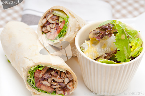 Image of kafta shawarma chicken pita wrap roll sandwich