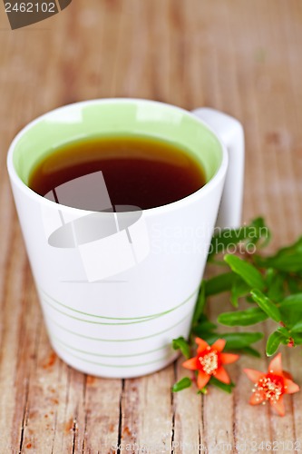 Image of cup of tea and flower