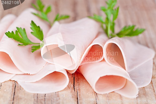 Image of slices of ham with parsley 