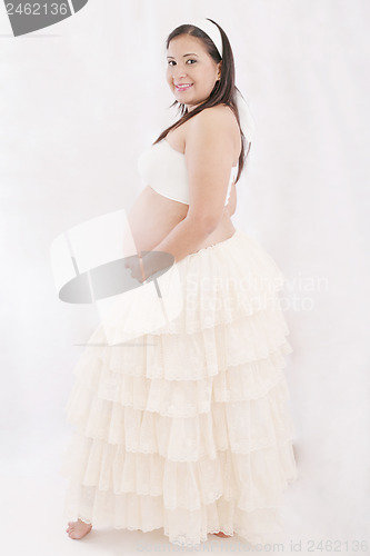 Image of Portrait of adorable pregnant woman in antique dress
