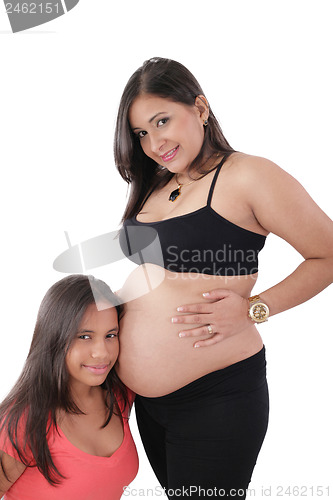 Image of Beautiful pregnant woman with her daughter