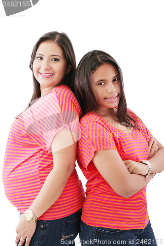 Image of Beautiful hispanic pregnant woman with her daughter