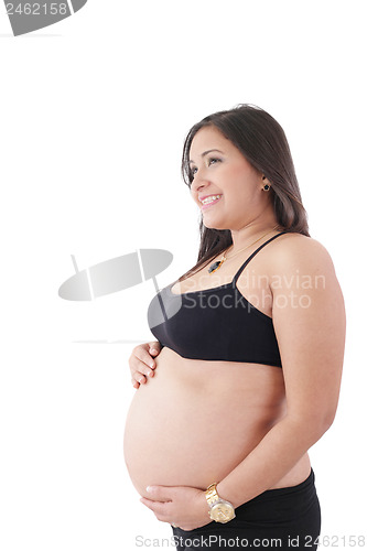 Image of Happy pregnant woman looking to a copyspace isolated