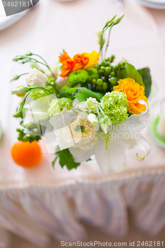 Image of tables decorated with flowers and fruit