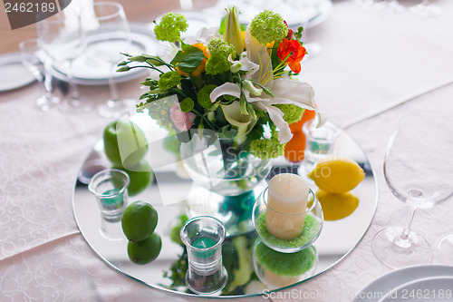 Image of tables decorated with flowers and fruit