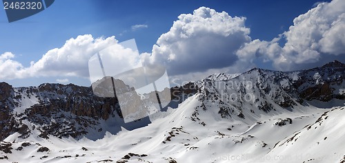 Image of Panorama of snowy mountains in sun day