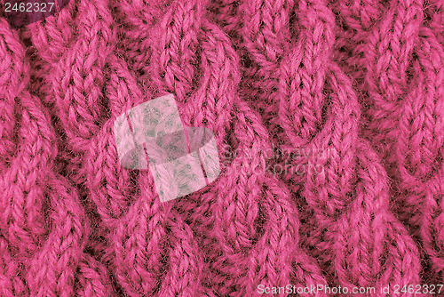 Image of Closeup of pink cable stitch knitting