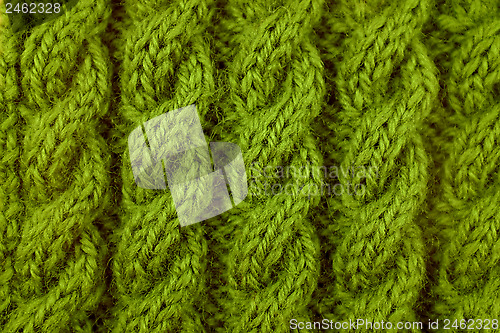 Image of Closeup of green cable knitting stitch