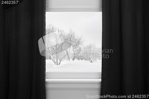 Image of Winter landscape behind black curtains