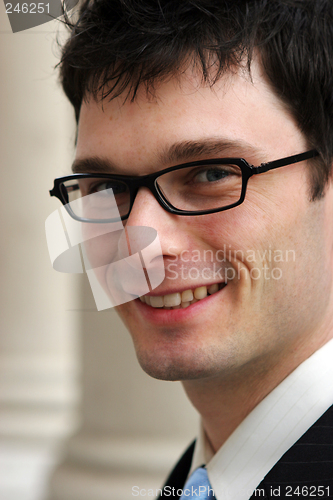 Image of Happy businessman wearing glasses