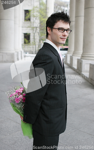 Image of Businessman with flowers