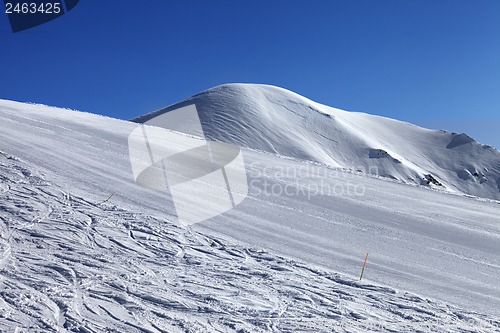 Image of Ski slope and blue cloudless sky in nice winter day