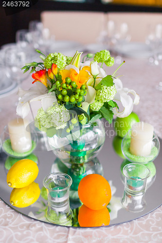 Image of tables decorated with flowers and fruit