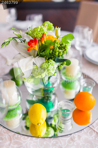 Image of tables decorated with flowers and fruit