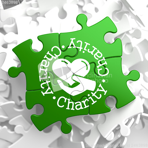 Image of Charity Concept on Green Puzzle Pieces.