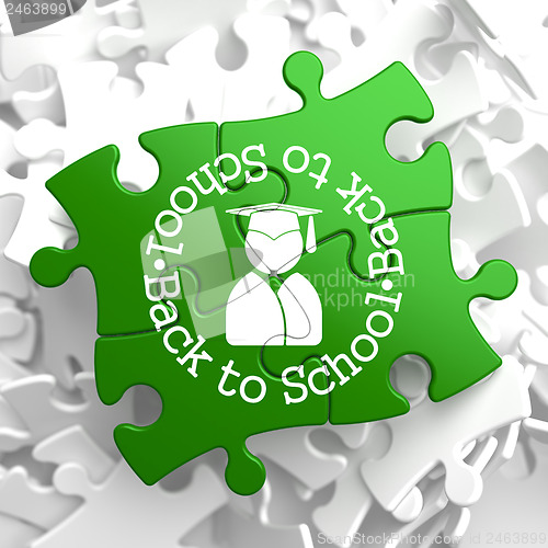 Image of Back to School on Green Puzzle Pieces.