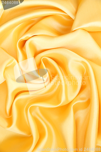 Image of Smooth elegant golden silk as background 