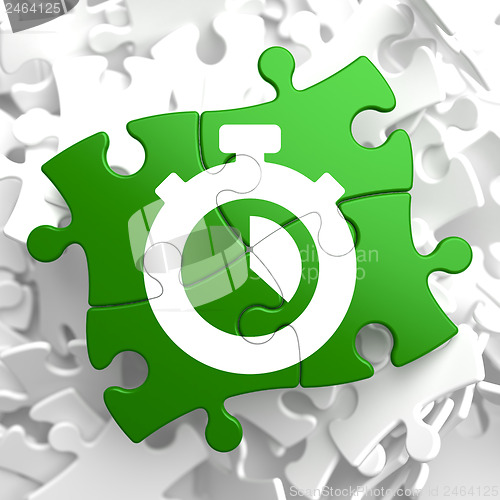 Image of Stopwatch Icon on Green Puzzle.