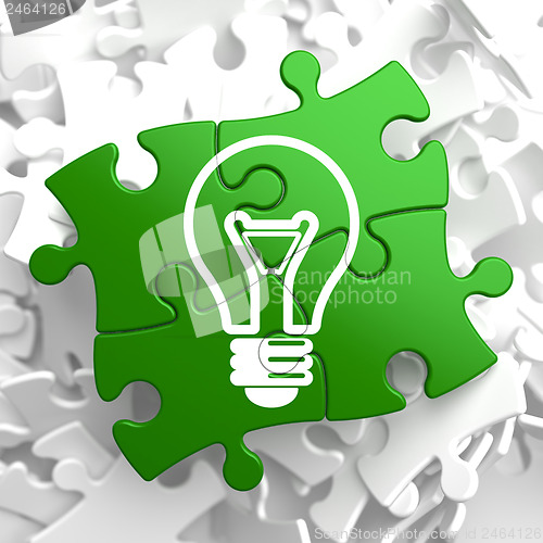 Image of Light Bulb Icon on Green Puzzle.