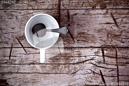 Image of empty white cup and spoon 