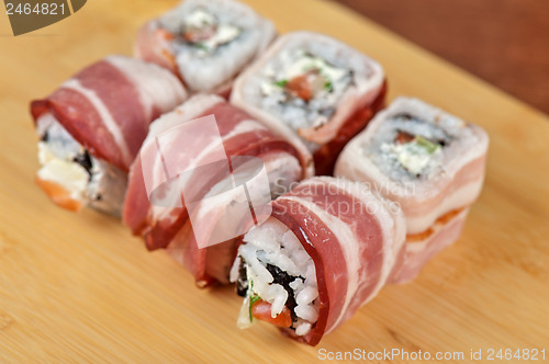 Image of Sushi roll with bacon