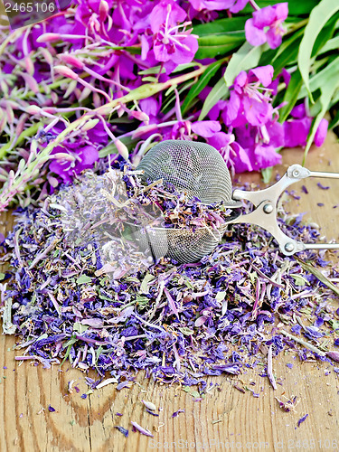 Image of Herbal tea from fireweed dry and fresh with a strainer