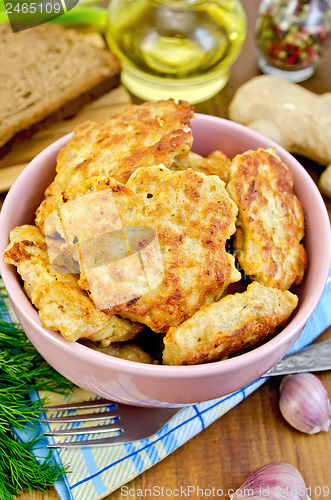 Image of Fritters chicken with bread and spices on board