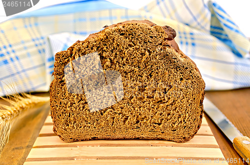 Image of Rye homemade bread on a wooden stand