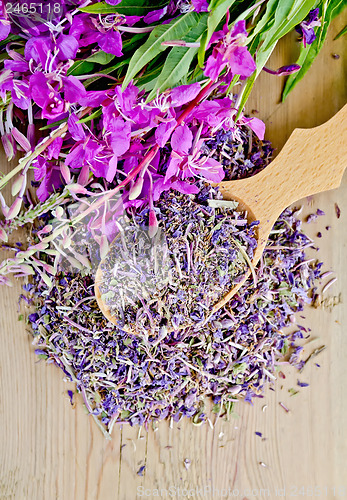 Image of Herbal tea from fireweed fresh and dry on a wooden spoon