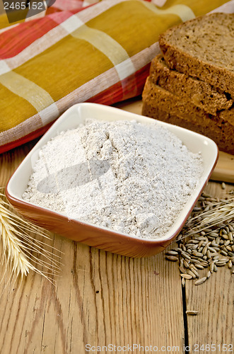 Image of Flour rye in a bowl with bread and ears rye