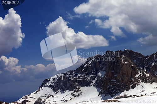 Image of Blue sky with clouds and snow rocks