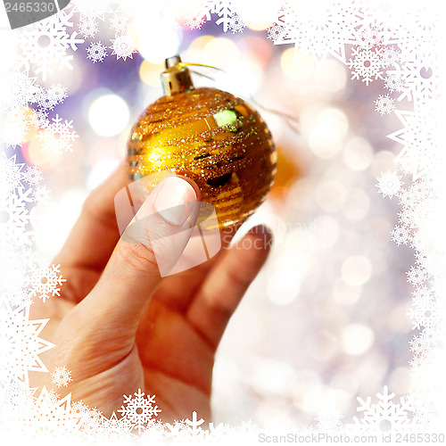 Image of Christmas-tree decoration on hand