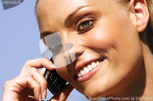 Image of woman talking on cell phone ll