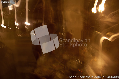 Image of The contours of people in a smoky nightclub smoking