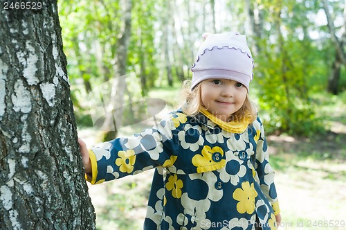 Image of Little girl in forest