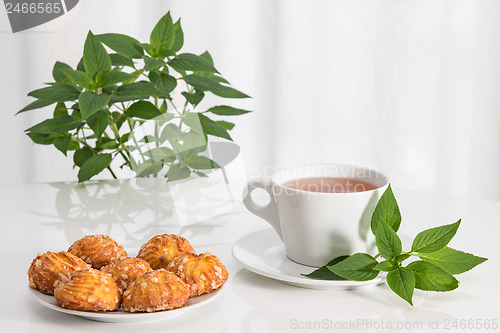 Image of Tea, mint and tasty cookies
