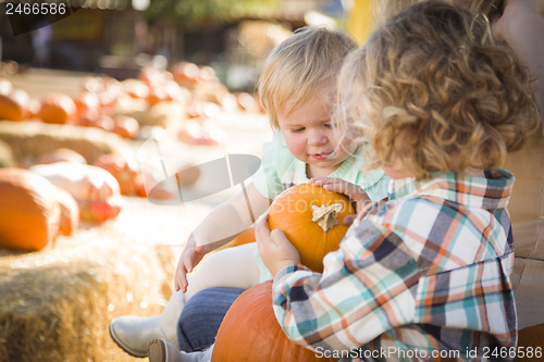 Image of Young Family Enjoys a Day at the Pumpkin Patch