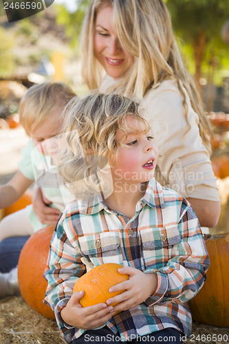 Image of Young Family Enjoys a Day at the Pumpkin Patch