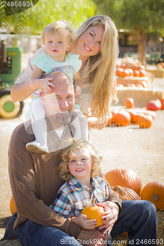 Image of Attractive Family Portrait at the Pumpkin Patch
