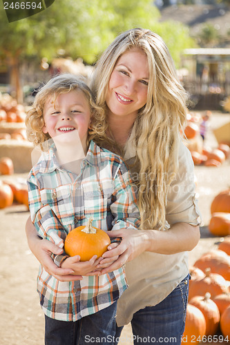 Image of Attractive Mother and Son Portrait at the Pumpkin Patch
