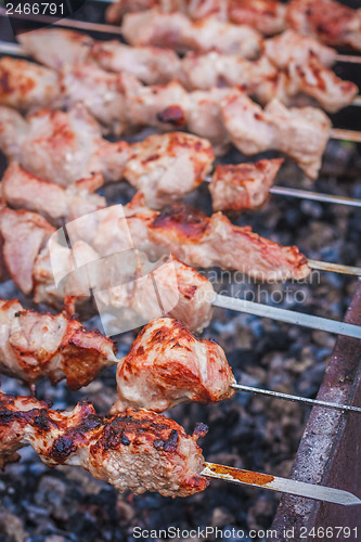 Image of Shish Kebab In Process Of Cooking On Open Fire Outdoors