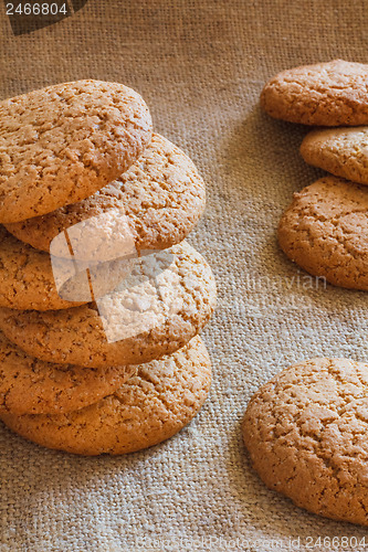 Image of Stacked Brown Cookies On Rustic Background