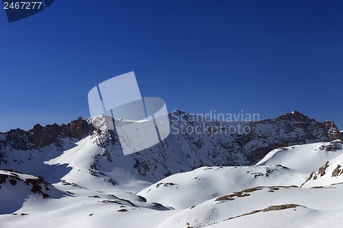 Image of Snowy mountains and blue sky in morning