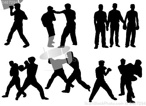 Image of black silhouette of boxing people