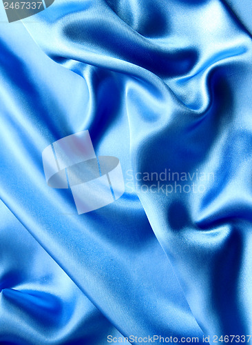 Image of Smooth elegant blue silk as background 