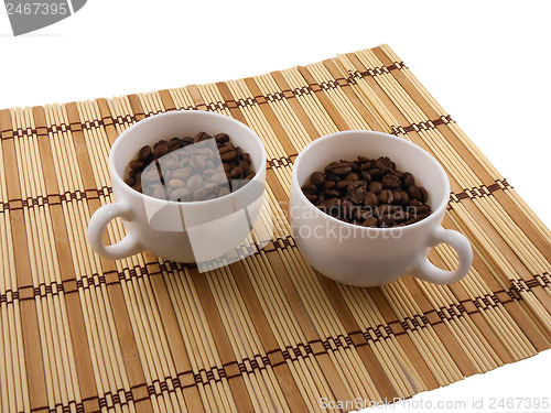 Image of Coffee beans, coffee cup on bamboo background