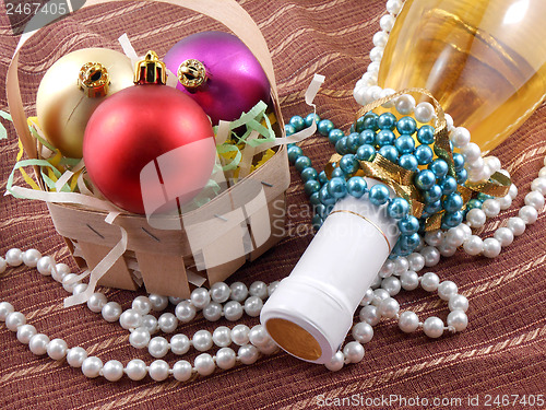 Image of Champagne bottle with Christmas balls and diamonds