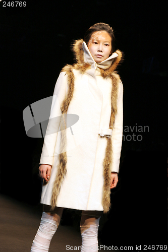 Image of Beautiful Asian fashion model on the catwalk during a fashion sh